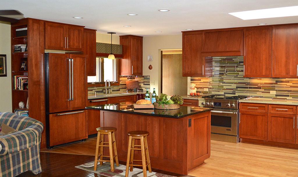Refrigerator and dishwasher feature cabinet door panels, bamboo flooring